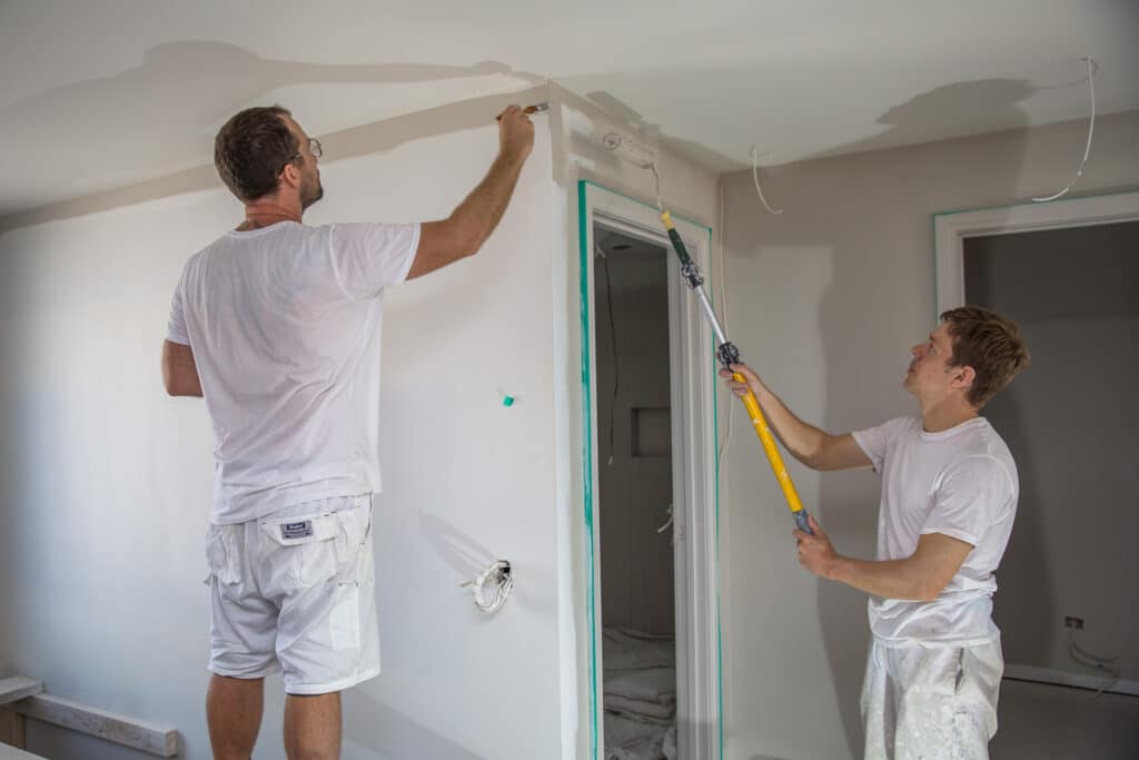 The team from Auckland City Painters painting an interior in Remuera