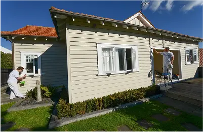Professional painters painting a bungalow home in Remuera